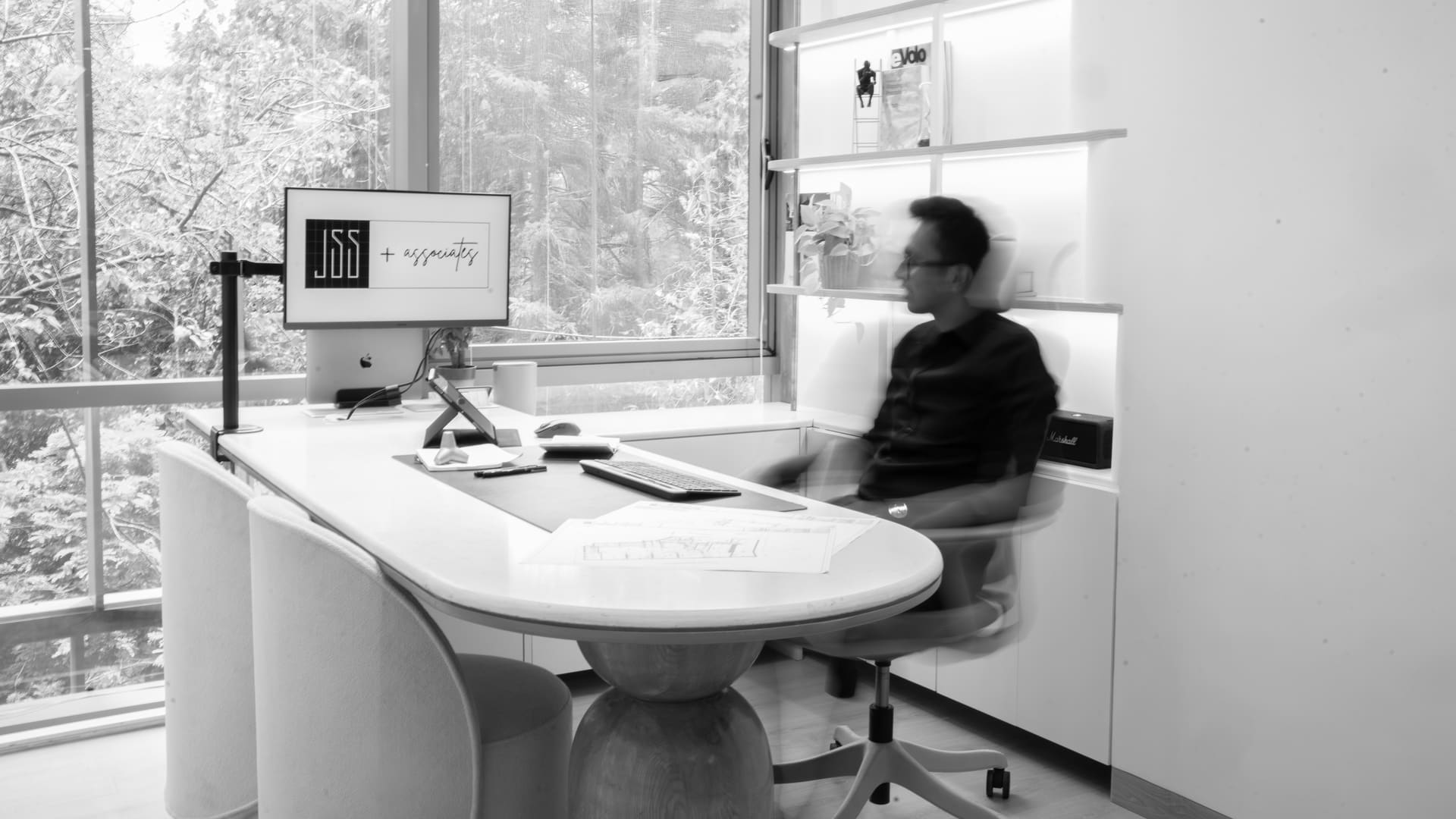 A founder at his desk in the JSS studio